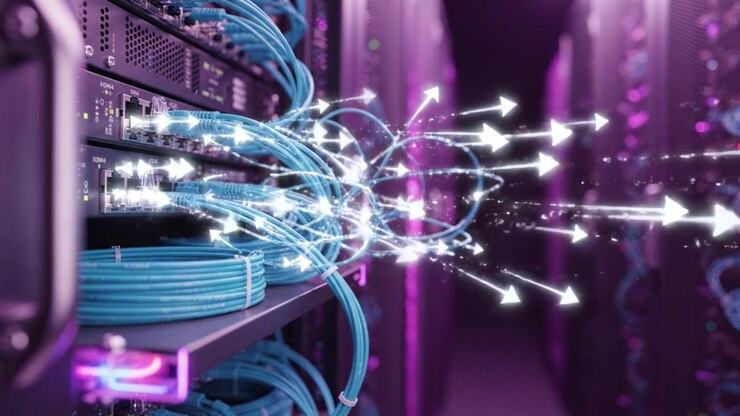 A Close-Up View of High-Tech Data Center Cables and Servers with Vibrant Purple Lighting for Enhanced Digital Connectivity and Infrastructure.