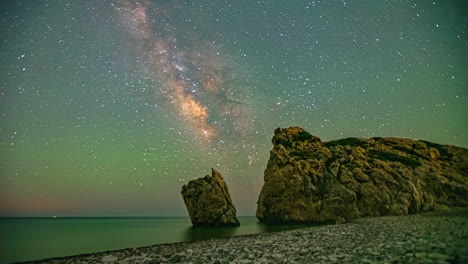 Time-lapse-at-night-of-starry-sky-in-Cyprus-aphrodites-rock-viewpoint-with-shooting-stars-and-ocean-view