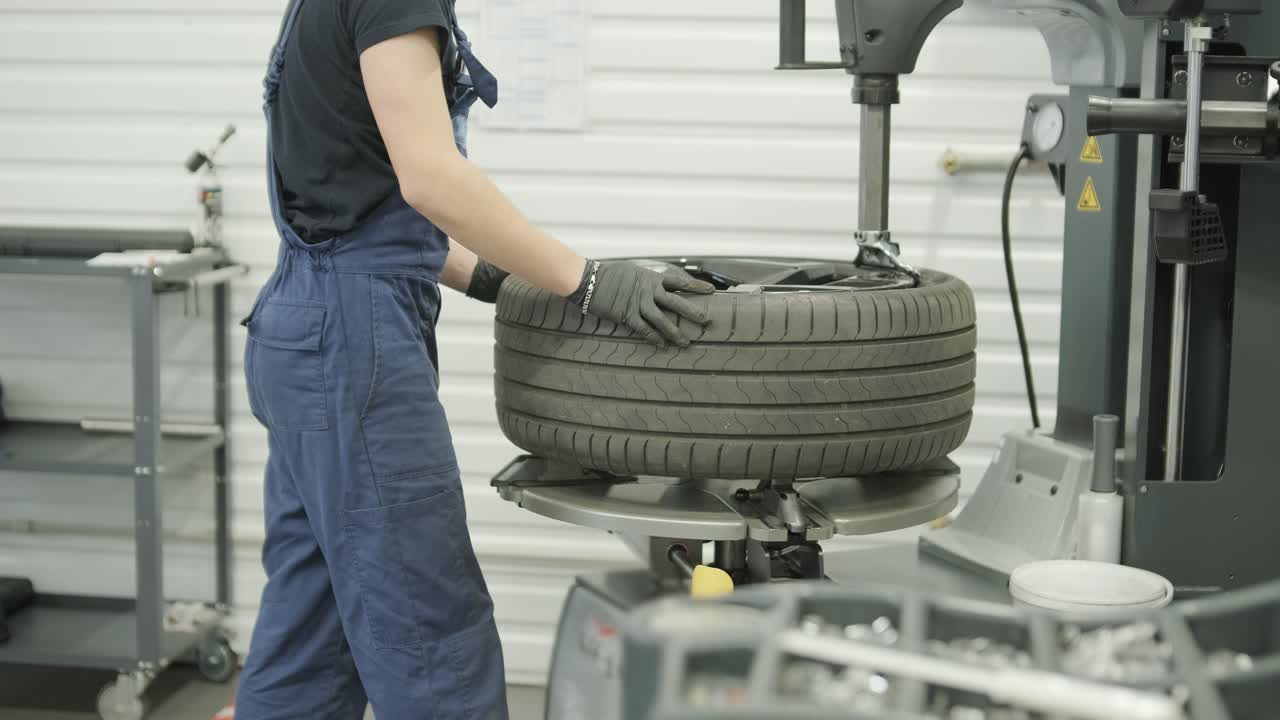 Tire changing and auto repair in a garage