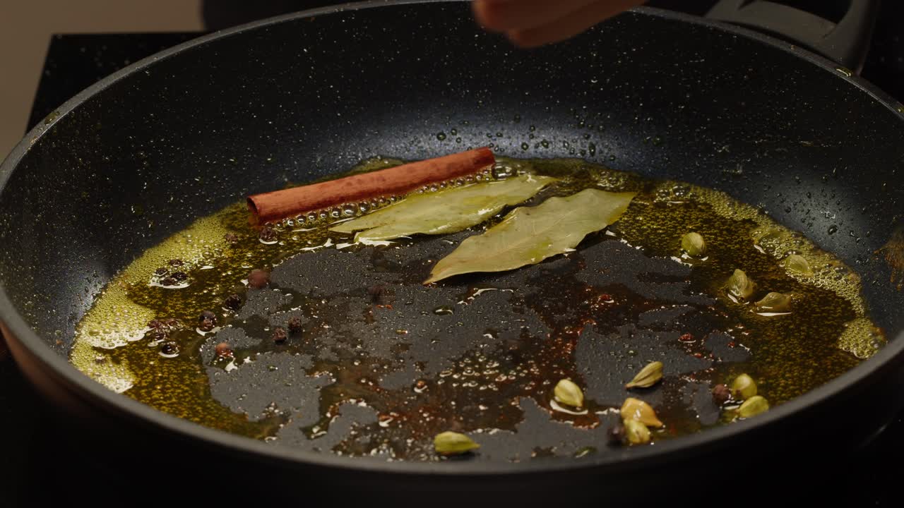 Spices cooking in a frying pan