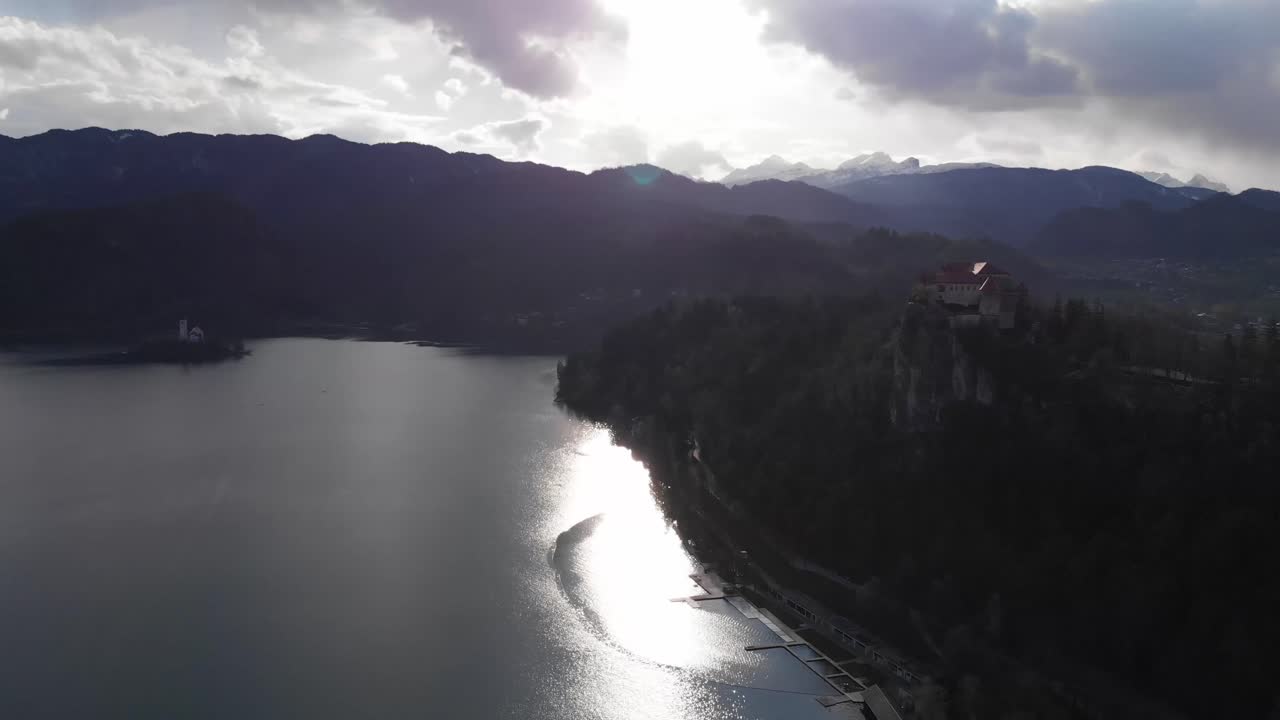 Aerial panoramic view of beautiful Bled Castle (Blejski Grad) with Lake Bled (Blejsko Jezero). Castle on top of the huge rock. Lake Bled with an island in the background.