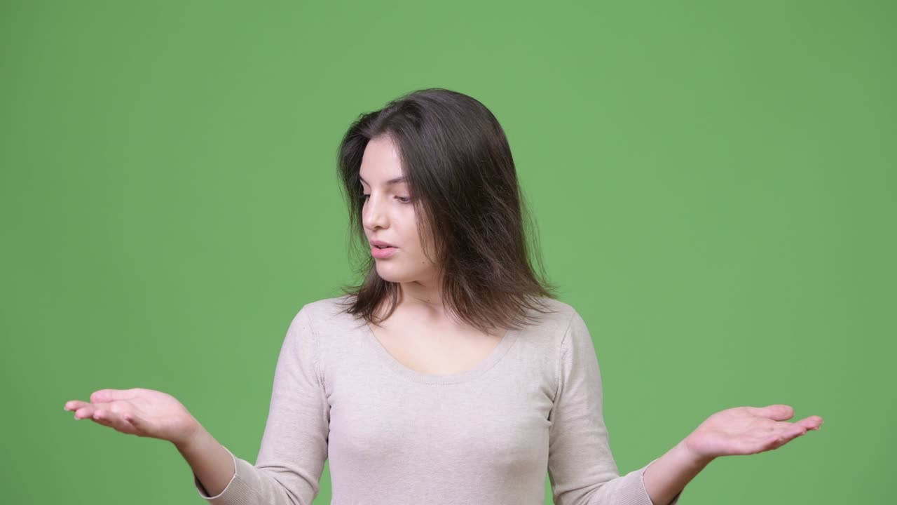 Young beautiful woman catching something