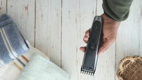 man holding a hair clipper