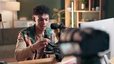 Man recording podcast with microphone and camera