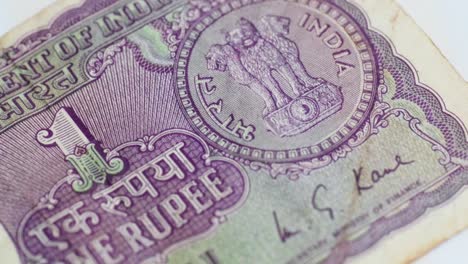 indian old one rupee note with finance secretary m.g.kaul signature and national emblem. internal shot, push in shot, 4k.