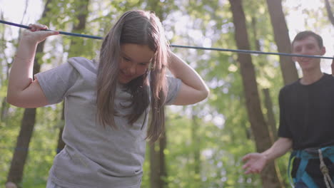 girls learn to walk on cable cars and overcome cliffs and rope crossings in a summer camp