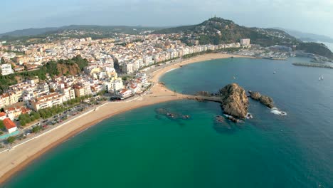 Aerial-view-with-Drone-of-the-city-of-Blanes,-main-square,-turquoise-blue-water,-Costa-Brava,-Lloret-De-Mar-and-Tossa-de-Mar
