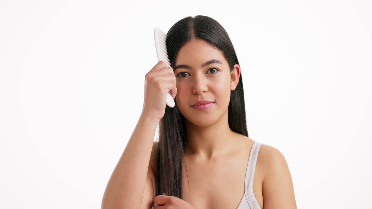 Woman combing her hair