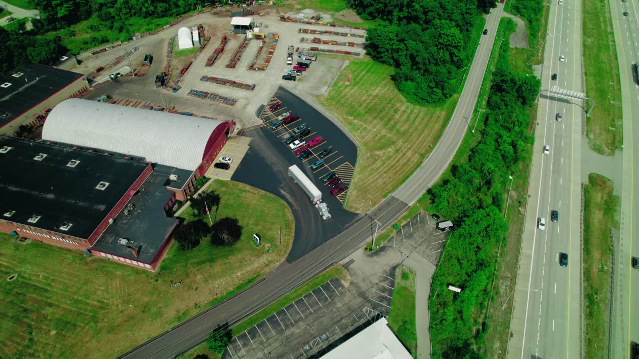 Logistics Hub Intersects with Highway, Showcasing Modern Supply Chain Infrastructure