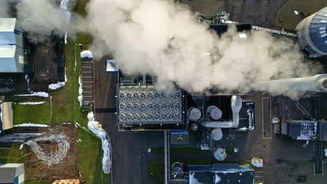 steam emissions from a district heating plant for an urban neighborhood - straight down aerial view