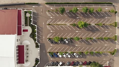 top view of an open parking lot with car spaces in symmetry