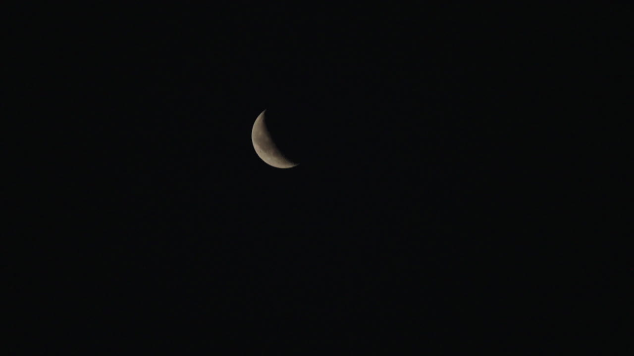 Crescent Moon in Dark Night Sky