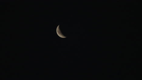 crescent moon in dark night sky