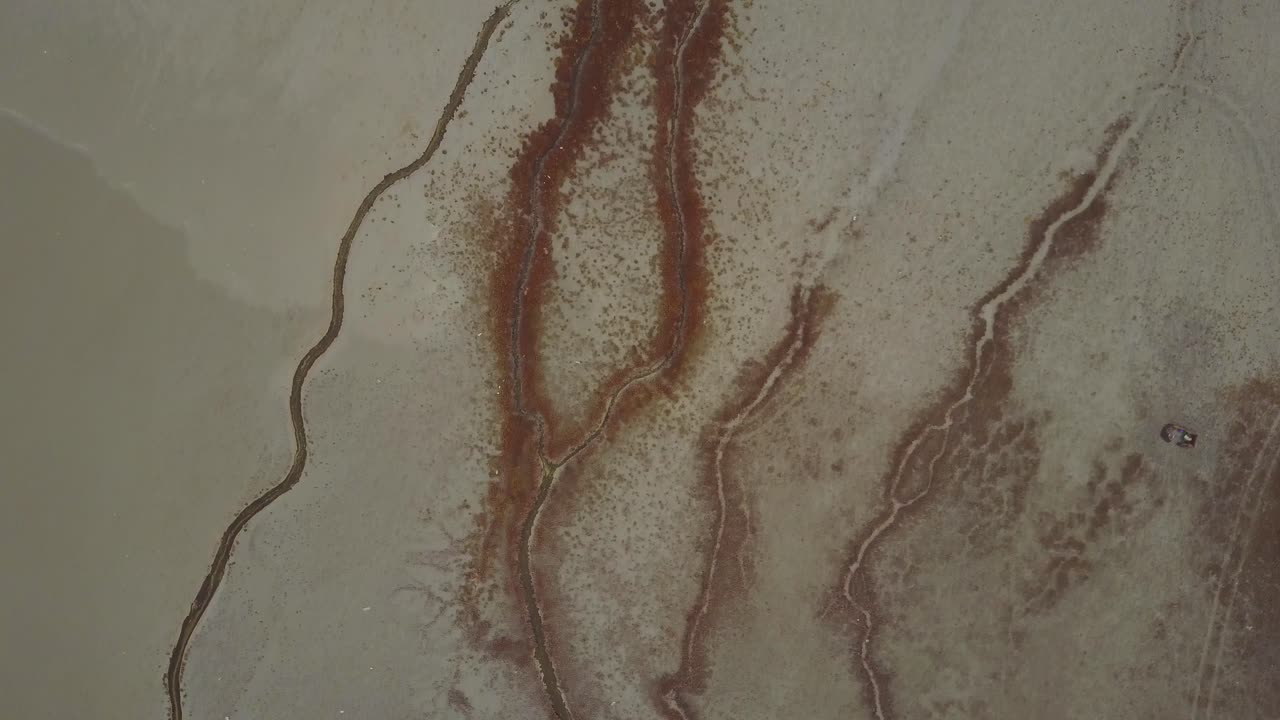 Cinematic shots at dusk on a foggy day next to a beach in Arifjan, Kuwait. Scenes do show natural formations that occured over the years.