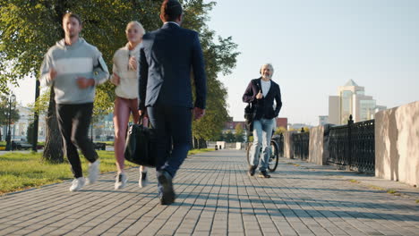 people walking in a city park