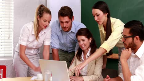 casual business team having a meeting using laptop