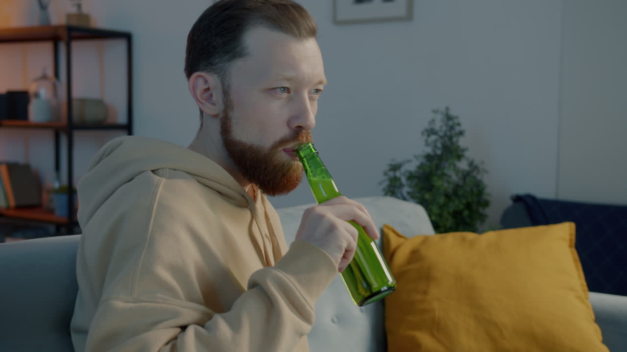 Man Drinking Beer Alone at Home