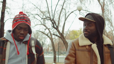 African-American-Men-Walking-and-Chatting-in-Park