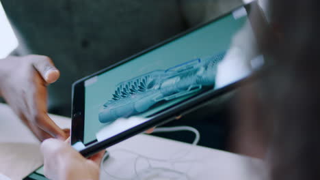 man holding a tablet in an office setting