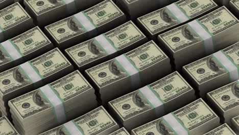 stacks of hundred dollar bills