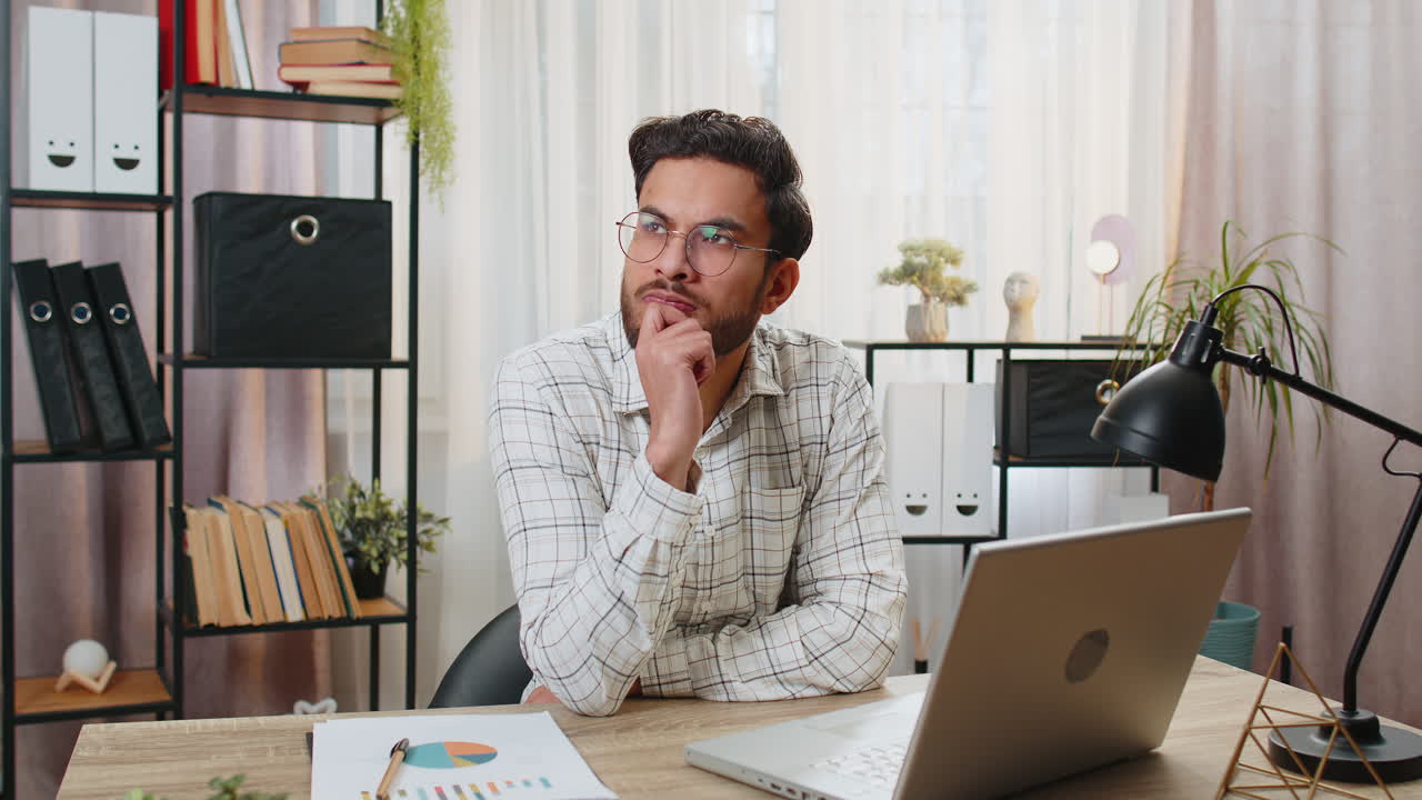Indian freelancer prepares startup project for presentation finds idea using laptop at home office