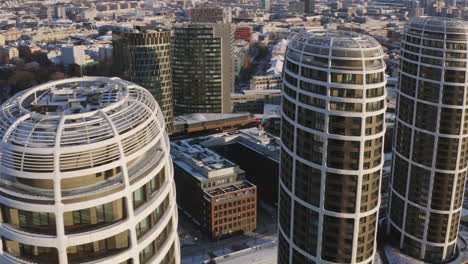 aerial drone shot of zaha hadid high rise buildings in bratislava city on sunny winter morning