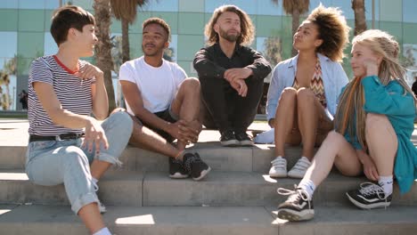 cool young diverse friends chilling on street