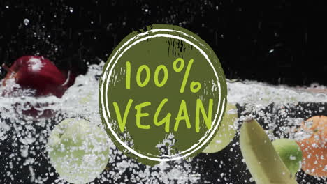 animación de texto vegano al 100 por ciento sobre fruta que cae en el fondo del agua