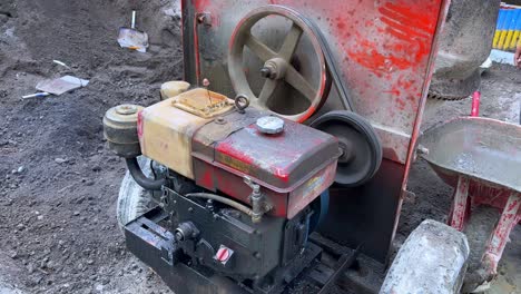Working-dirty-engine-of-concrete-mixer-machine