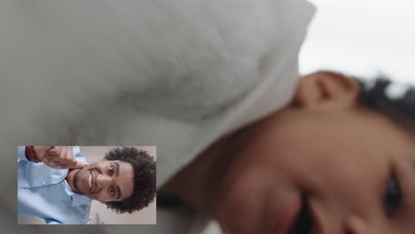 funny baby video chatting with father on smartphone dad greeting toddler enjoying communicating with child on video chat at home vertical orientation