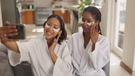 two women taking a selfie with eye patches on