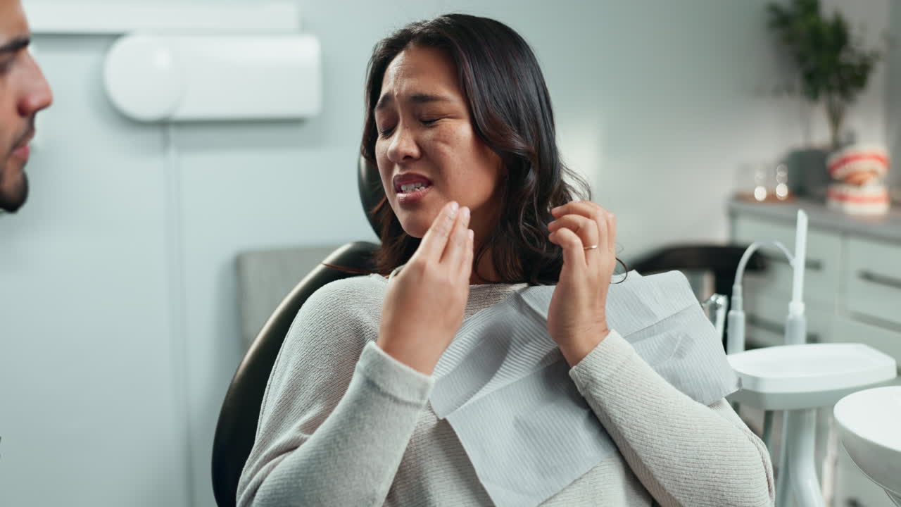 A dentist examining a patient's mouth