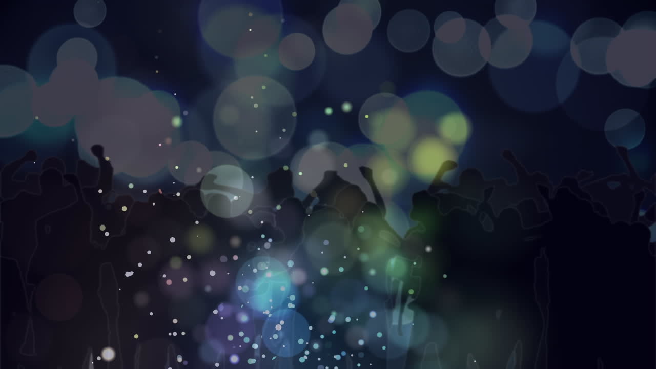 스포트라이트와 함께 춤추는 군중 위에 빛의 초록색과 파란색 보케 스 ⁇ 의 애니메이션