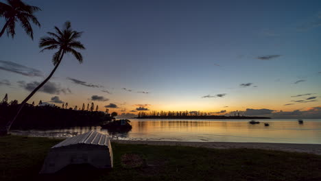 Small-boats-move-with-the-current-on-a-secret-bay,-Isle-of-Pines