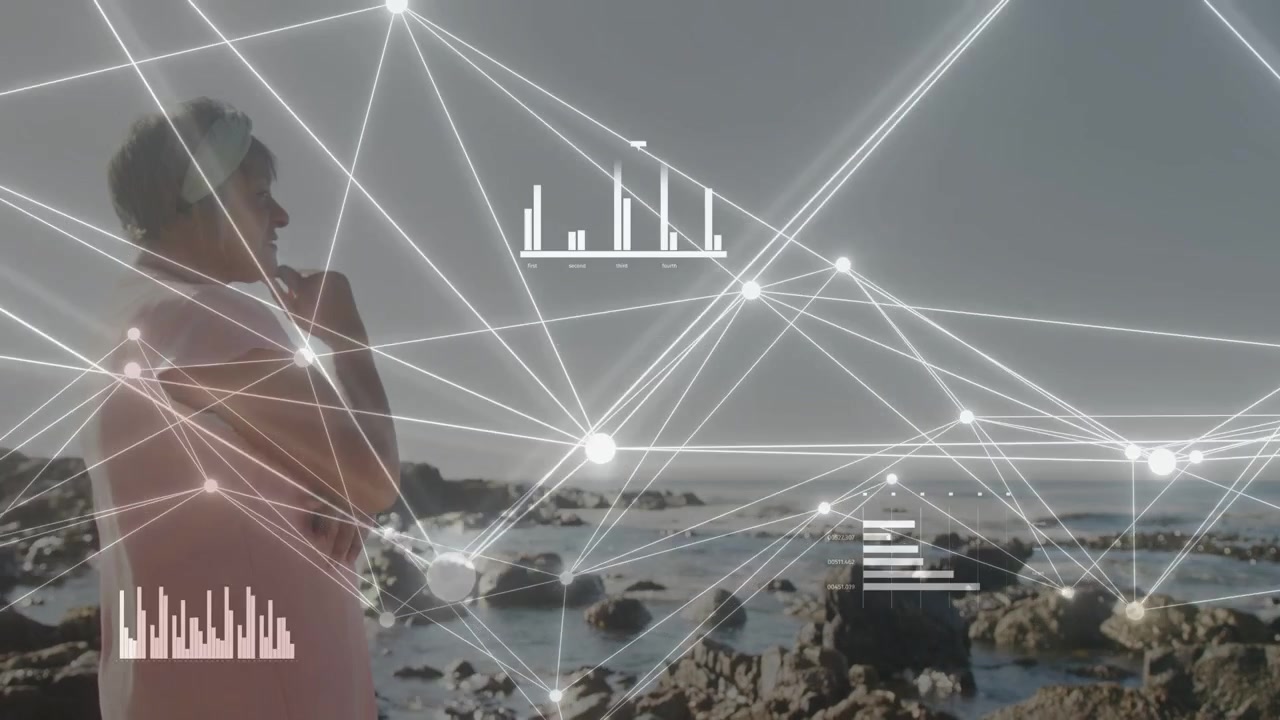 Senior woman standing on rocky coast, tech feed activating network and showing data with bar charts
