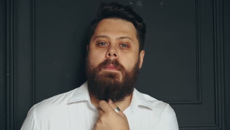 gentleman posing in studio. portrait of stylish handsome man with beard in studio