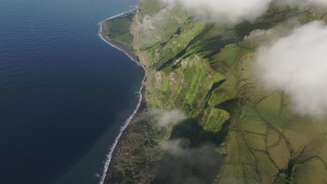 panoramic view of rough coastline at fajã de lopo vaz azores - drone shot