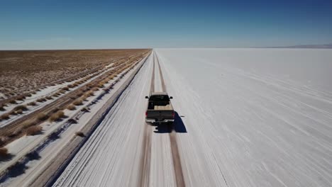 truck driving through a salt flat