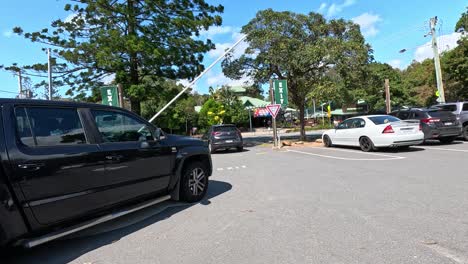 car passing through boom gate at currumbin beach