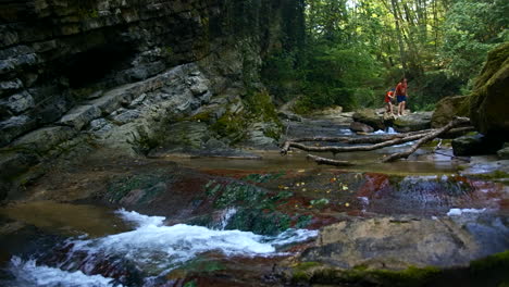 waterfall in a forest with people