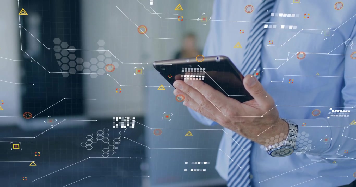 Mature businessman tapping tablet corner in lobby while swiping and expanding analytics overlay