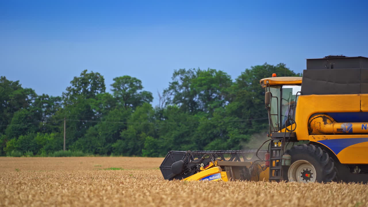 Rural work in the field. A large agricultural machine working in field