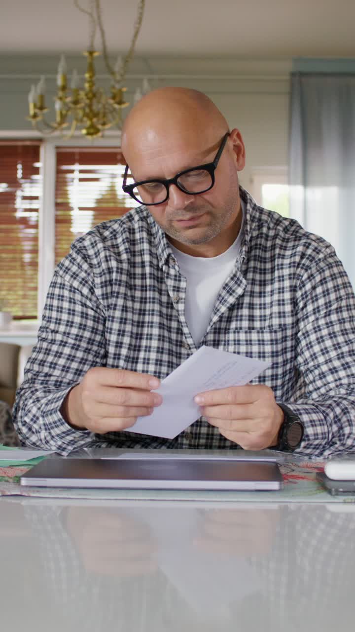 Man Paying Cable Bill at Home