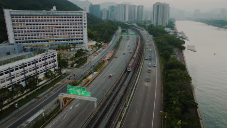 aerial view of hong kong main highway connection with downtown drone fly above cars traffic monitoring smog and pollution in the metropolis