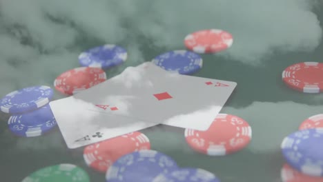 Animation-Von-Casino-Spielkarten-Und-Chips-über-Wolken