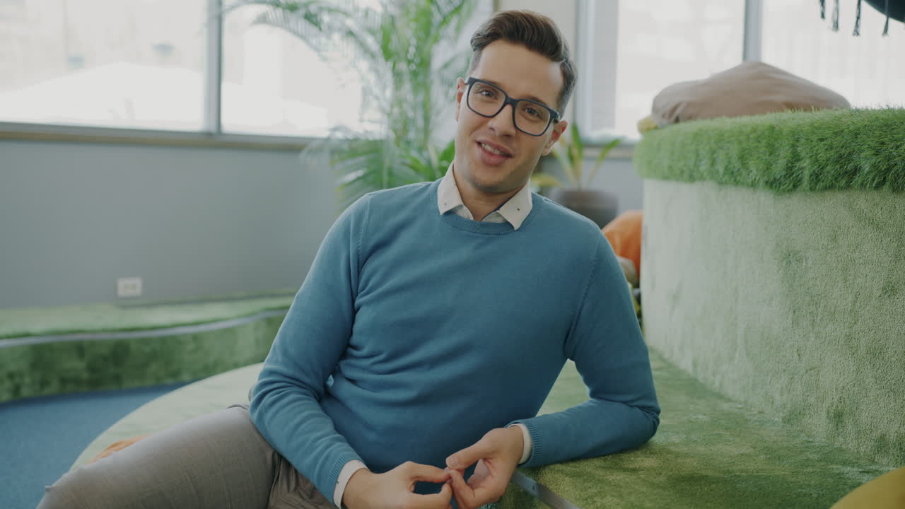 Man in office setting giving presentation.