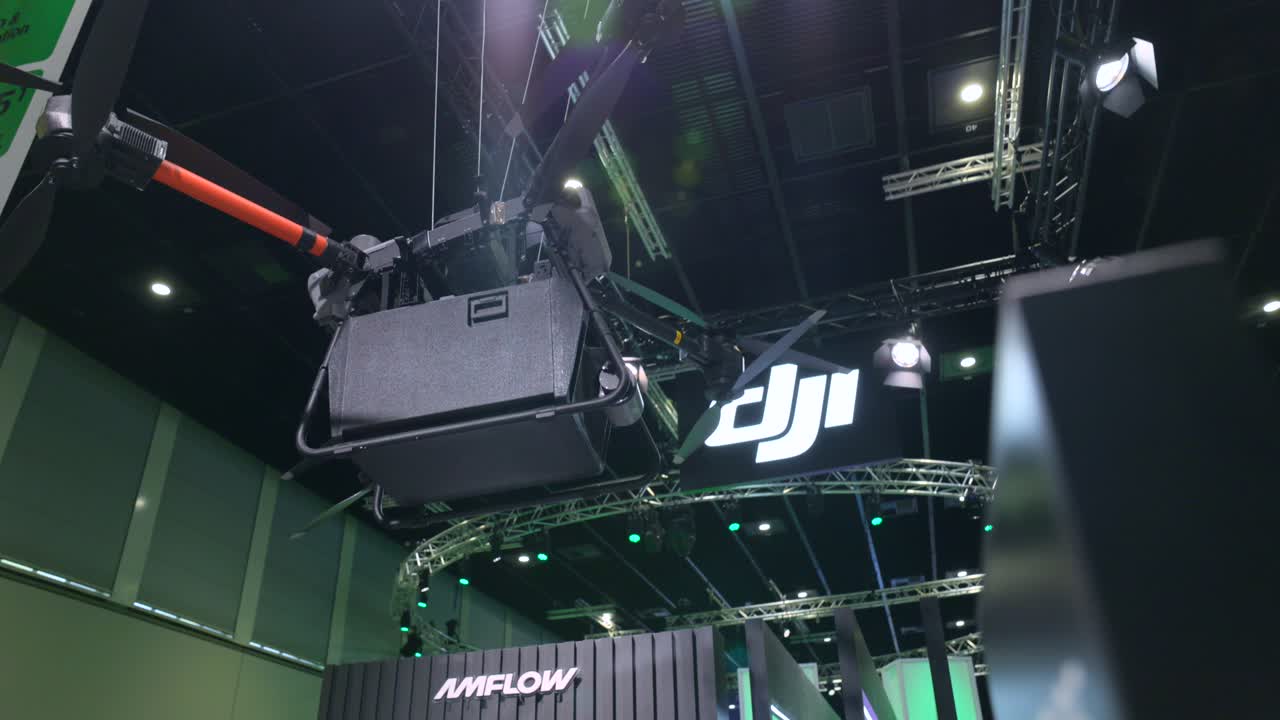 DJI FlyCart30 Aerial Delivery Drone Hanging At IFA Exhibit In Berlin, Germany. low angle shot