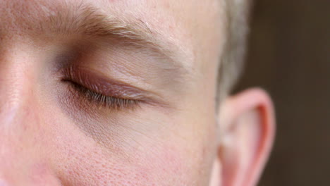 closeup of the eye of a man showing awareness