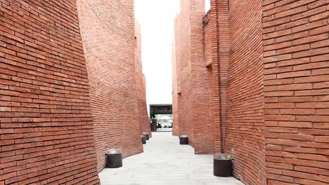 camera moves through a brick passageway