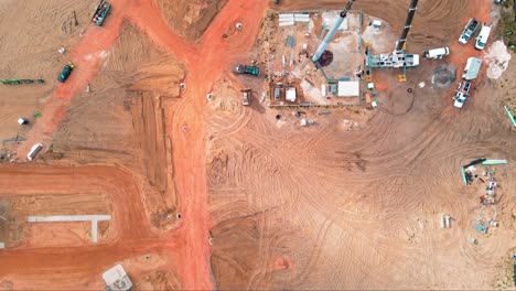 a 4k top down drone shot of a birds eye view of a construction site then beautiful residential vacation homes in florida with people relaxing in their air bnbs and vrbo vacation rental homes